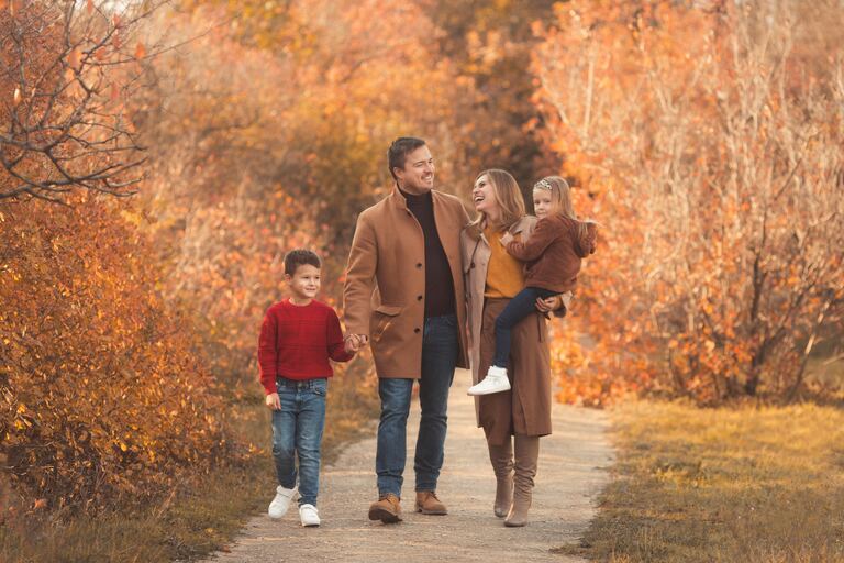 Family walking together through an autumn park