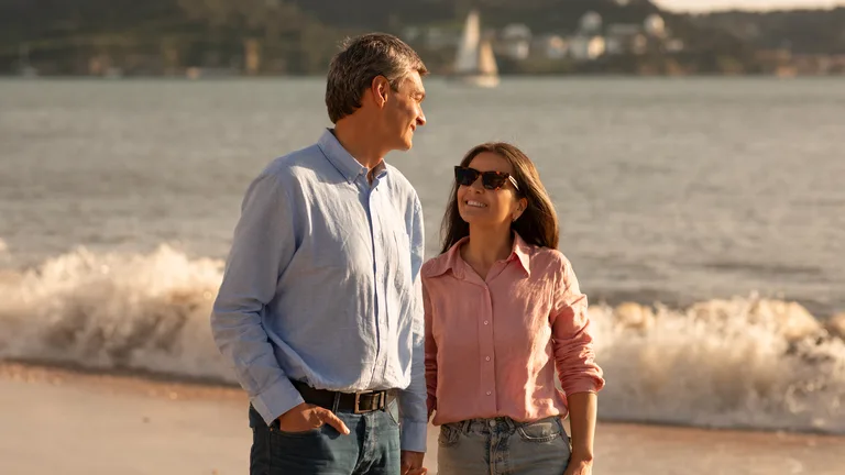 Couple walking the beach at sunset in conversation — couples therapy in Jupiter, Florida