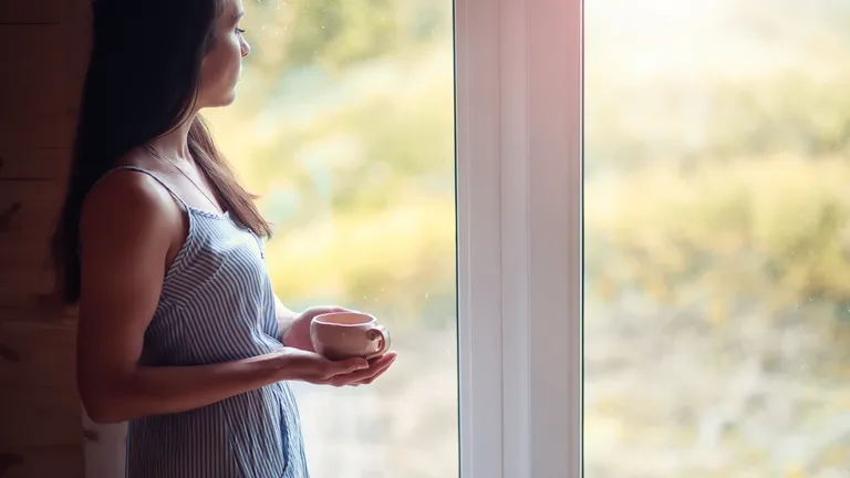 Woman at peace in soft morning light — trauma therapy in Palm Beach Gardens
